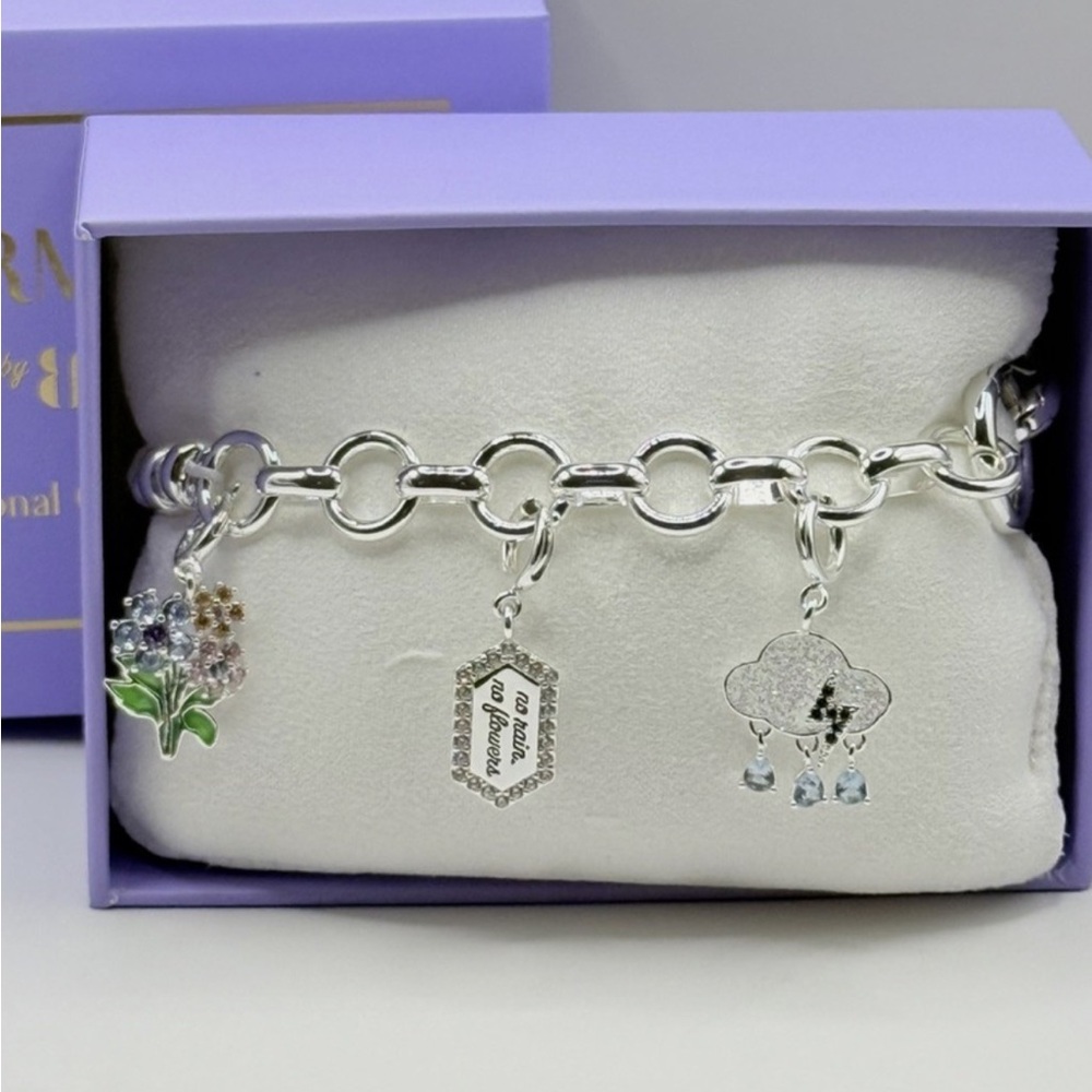 Silver Charm Bracelet with Floral and Cloud Accents